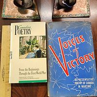 Front covers of both books with rulers for scale