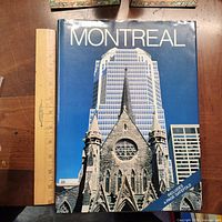 Front cover of Montreal hardcover book with ruler for scale