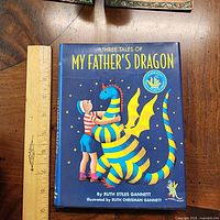 Front cover showing title, illustration, size reference with ruler