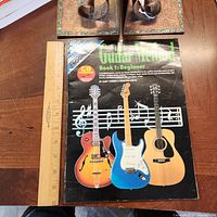 Front cover showing title, guitars illustration, CD included label