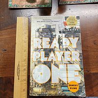 Front cover with title, author, motion-picture sticker, ruler for scale