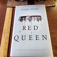 Front cover of Red Queen hardcover showing dust jacket artwork