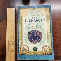 Front cover of book with ruler for scale