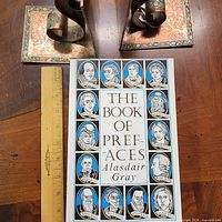 Front cover of paperback book with ruler for scale