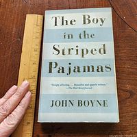 Front cover of trade paperback with ruler for scale