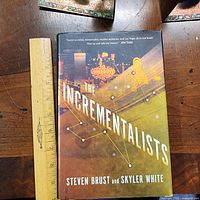 Front cover with dust jacket and ruler for scale