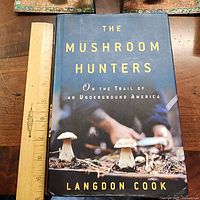 Front cover with dust jacket, ruler for scale