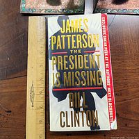 Front cover with title and author names, ruler for scale