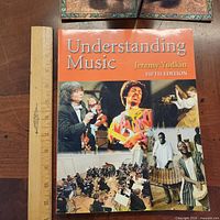 Front cover of textbook with ruler for scale