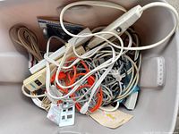 Top view of tote showing power strips, mixed cords and Disk Care kit