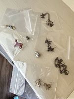 All horse motif jewellery laid out in separate plastic bags