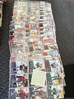 Stack of sleeved pages displaying large quantity of cards