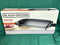 Front of sealed retail box showing Black+Decker family-size electric griddle