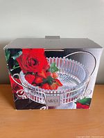 Factory box displaying Mikasa crystal serving bowl with roses graphic