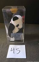 Front view of Fortune panda in clear display case with swing tag visible