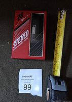 Front view showing red and black casing and cassette door