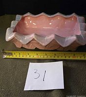 Full view of planter with tape for scale