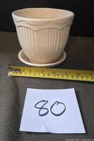 front view showing ribbed body and ruler for scale