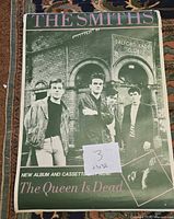 Full view of poster front showing band photo and titles