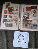Open album showing multiple Lenin themed stamps affixed to both pages