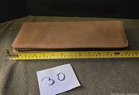 Top view of closed case with tape measure showing length ~38 cm