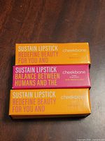 Front view of three boxed Cheekbone Beauty Sustain Lipsticks