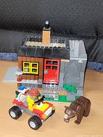 Cabin, ATV and bear overview