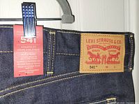 Close-up of leather brand patch and tag indicating 541 Athletic Fit