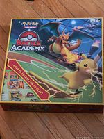 Front of Pokémon Battle Academy box showing Pikachu and Charizard artwork