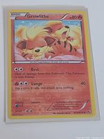 Growlithe card in protective sleeve showcasing front artwork and RC4/RC25 numbering