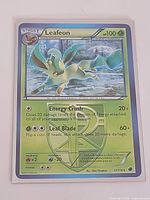Front view of Leafeon 11/116 card showing artwork, stats and condition