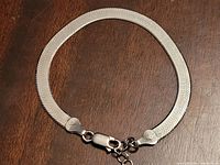 Bracelet laid flat to show full length, clasp, and extender