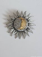 Front view showing sun ray design with gold crescent and stars