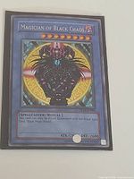 Front of Magician of Black Chaos card showing artwork, stats, and condition.