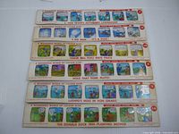 Six Disney colour slide strips laid out showing titles and frames