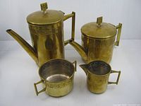 Full view of all four brass pieces