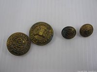 front view of four CPR buttons showing size variation and logos