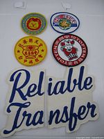 All five patches arranged, showing size and design variety