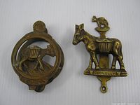 Both brass door knockers front view