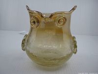 front view of amber crackle glass owl vessel