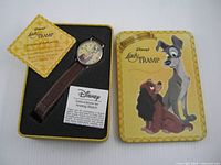 Watch, tin, certificate and instructions arranged in foam insert