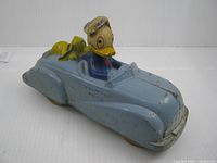 Left front view showing Donald driver, Pluto figure, body paint wear