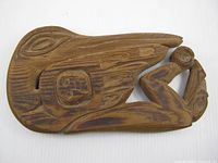 Front view showing full carved plaque design