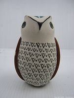Front view of pottery owl showing overall design and breast pattern