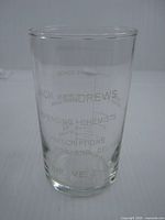 Full view of glass showing printed text and graduated markings