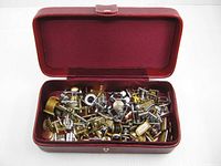 Open red Lance box showing interior and cufflinks inside