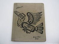 front view of leather cover showing bird motif and titles