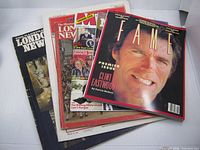 Stack of all six magazines showing covers and relative condition