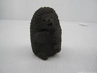 Front view of clay hedgehog figurine