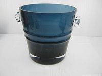 Front view showing blue glass body and clear handle